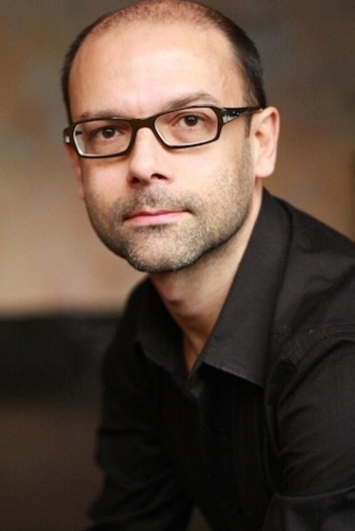 Гилберт Траïна