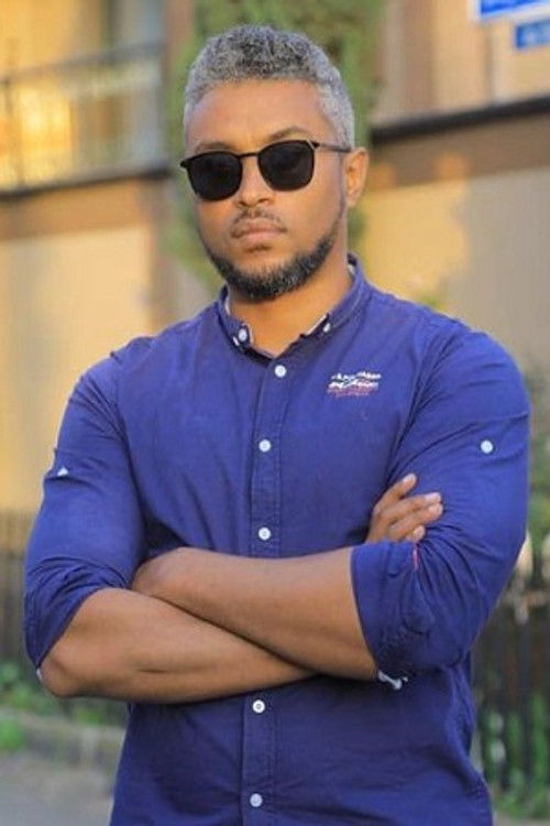 Биниам Аман