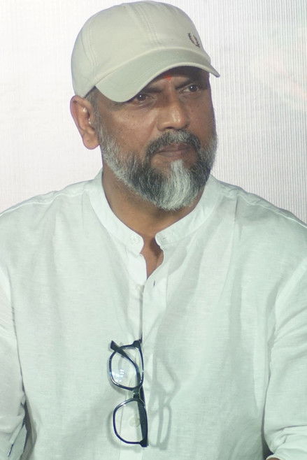 Лаxман Утекар