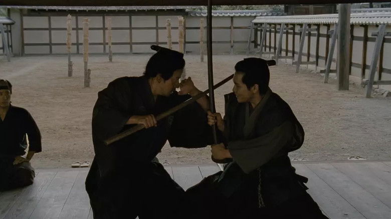 кадр из фильма Падающая камелия