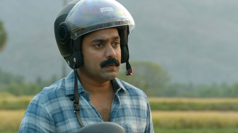 кадр из фильма കൂമൻ