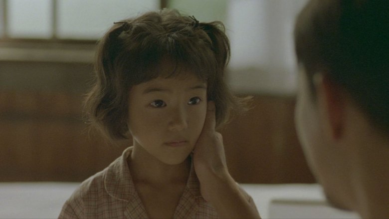 кадр из фильма 愛を乞うひと