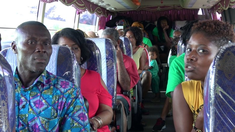 кадр из фильма Life and Debt