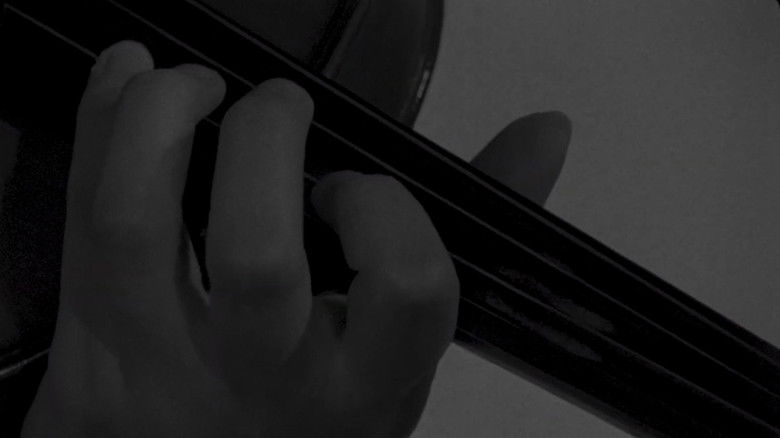 кадр из фильма The String That Binds Me