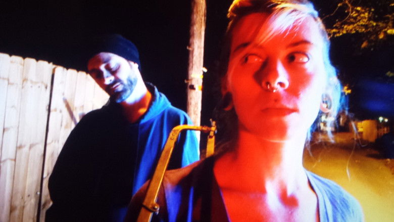 кадр из фильма Hooker with a Hacksaw