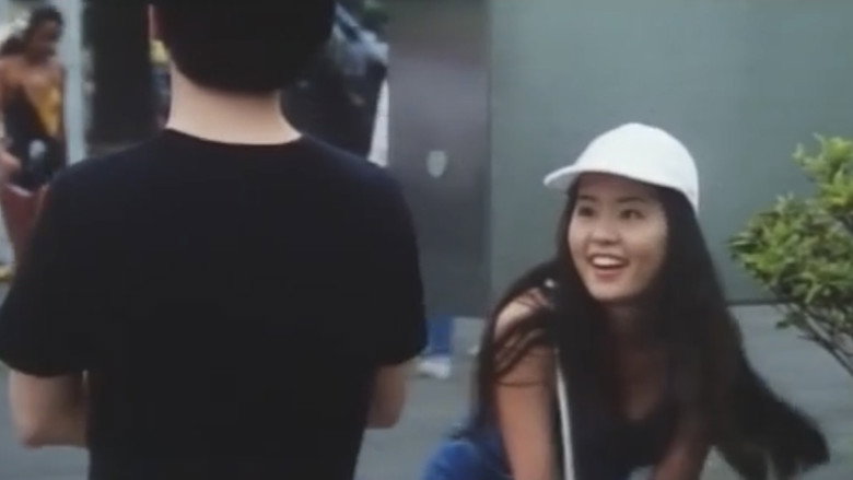 кадр из фильма 女高生 夏ひらく唇