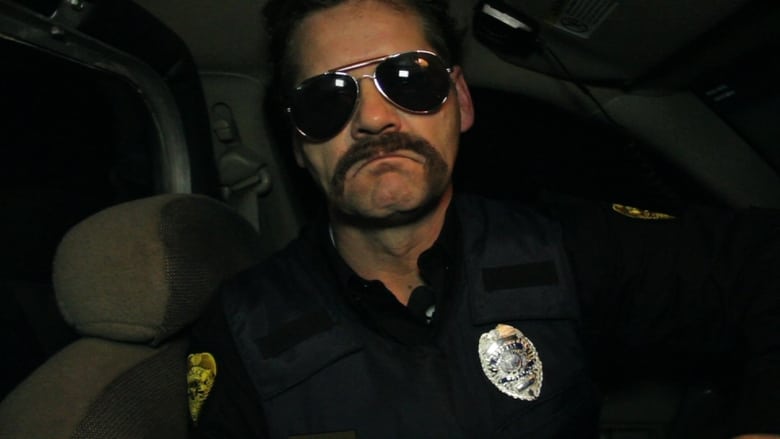кадр из фильма 911: Officer Down