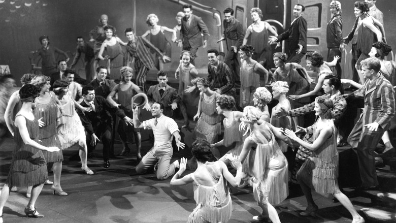 кадр из фильма Поющие под дождём