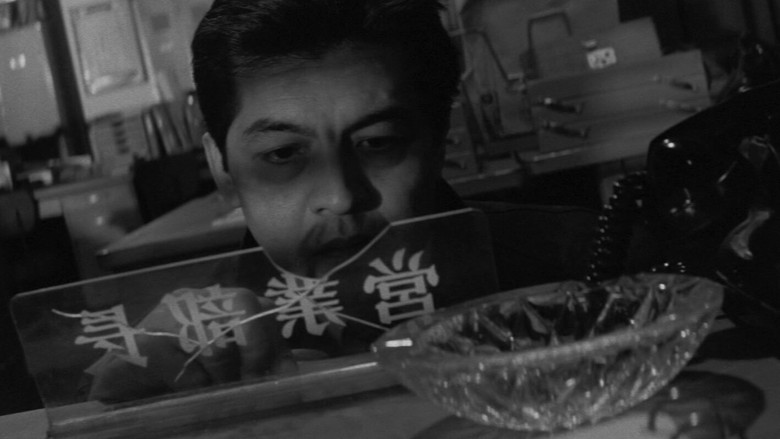 кадр из фильма 脅迫