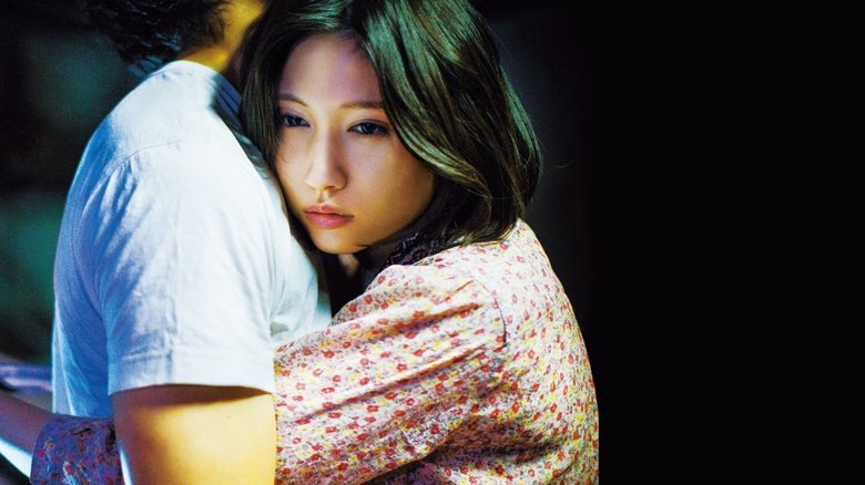 кадр из фильма 雨にゆれる女