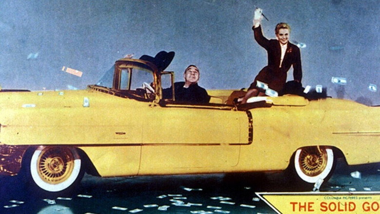 кадр из фильма «Кадиллак» из чистого золота