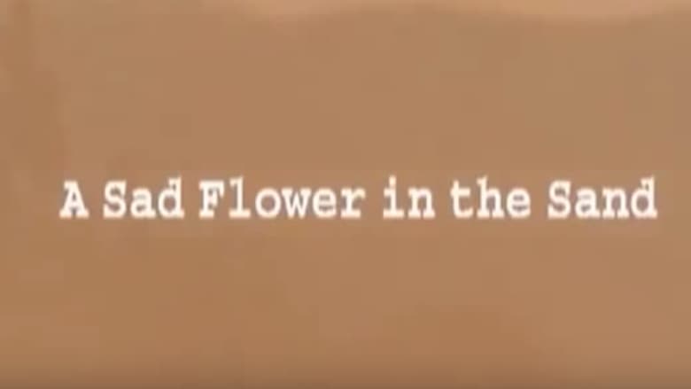 кадр из фильма A Sad Flower in the Sand