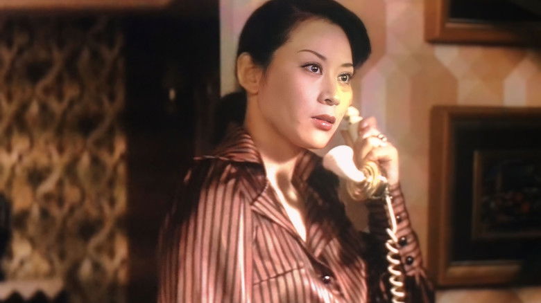 кадр из фильма 色情妻　肉の誘惑