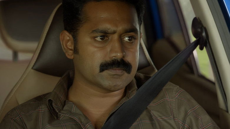 кадр из фильма കൂമൻ