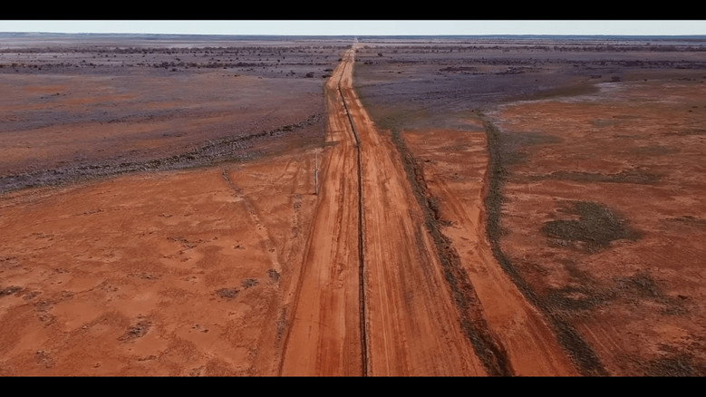 кадр из фильма The Dingo Fence