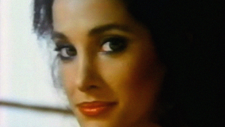 кадр из фильма She's Dressed to Kill