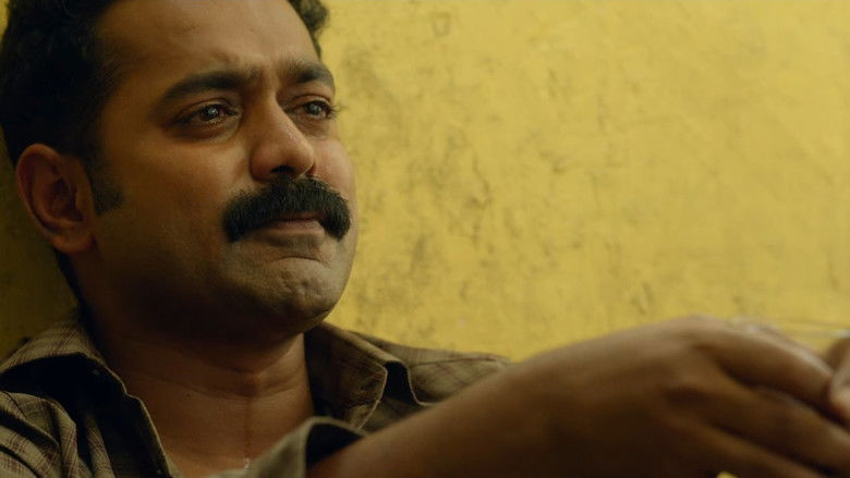 кадр из фильма കൂമൻ