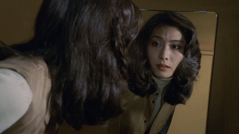 кадр из фильма 闇に抱かれて