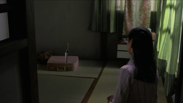 кадр из фильма 黒い下着の女