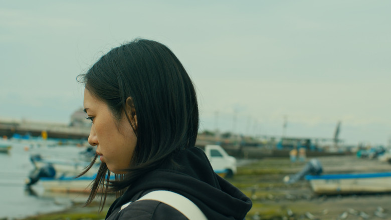 кадр из фильма さざなみに揺れる手